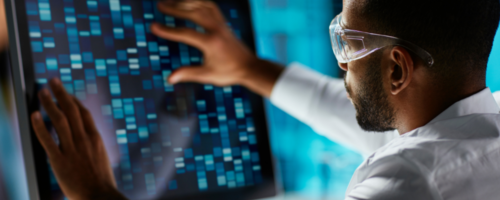 Scientist engaging with data sequencing on a laptop